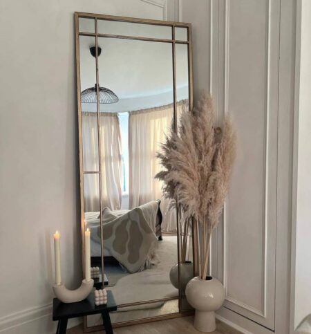 The use of large mirrors makes the space appear larger